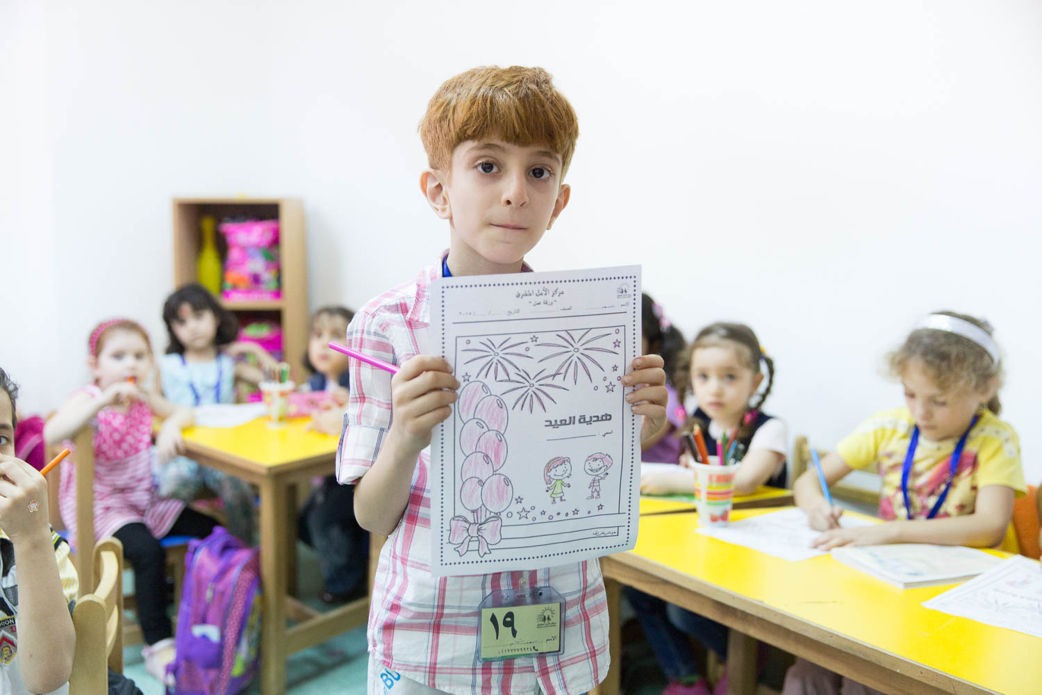  Young children color pictures in the daycare centre run by NGO Ansan. 