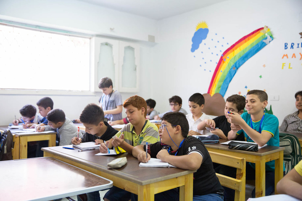 Boys study during remedial classes offered by NGO Ansan and Plan International.