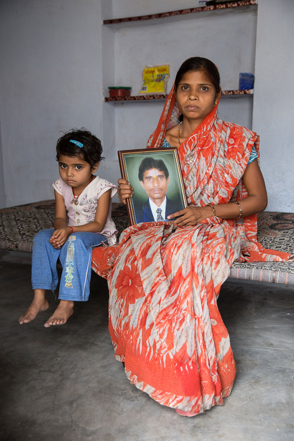  Sunita Devi Gupta, 30, with Saniya, one of her three children. She lost her husband to alcoholism in 2012. She works in the Opus III women's project. 