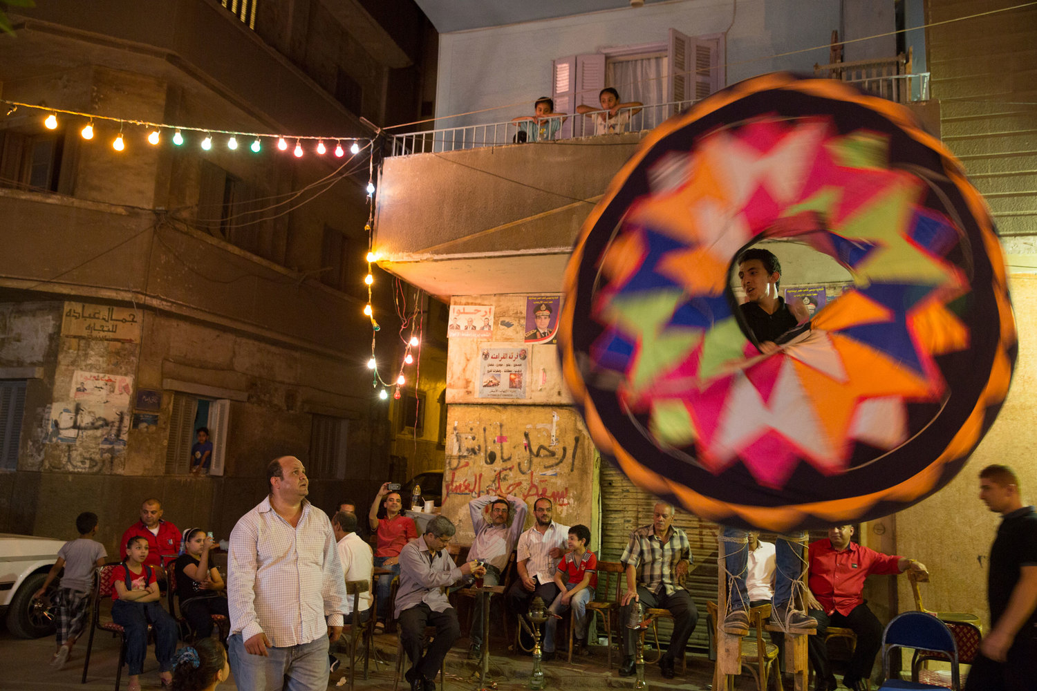  A group of local men from Sayeda Zeinab perform their skills at a local party in the side streets of the neighborhood. 